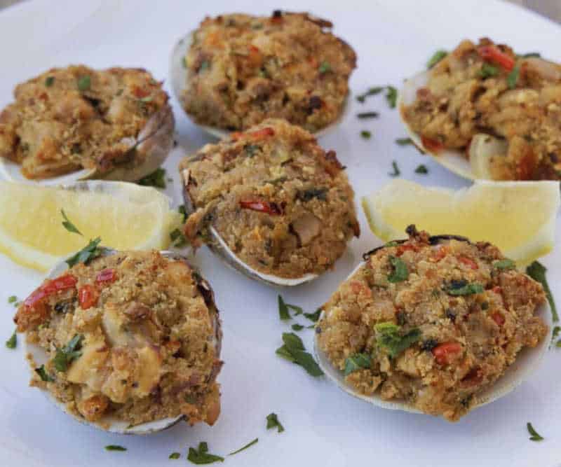 Stuffed Clams Appetizer at Ciao Ragazzi A plate of golden-brown stuffed clams garnished with parsley and lemon wedges, served as a classic Italian appetizer at Ciao Ragazzi.
